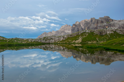 Paterno mountain reflected in smooth surface water of Laghi dei Piani, Dolomites, Trentino Alto Adige, Italy photo