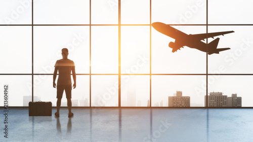 man in airport and plane