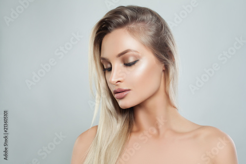 Nice Woman with Fresh Skin and Healthy Blonde Hair. Facial treatment. Cosmetology, beauty, haircare and spa