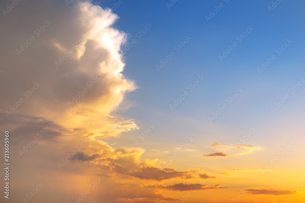 Natural sunset or sunrise with vibrant colors. Dramatic colorful sky background. Clouds over half of horizon