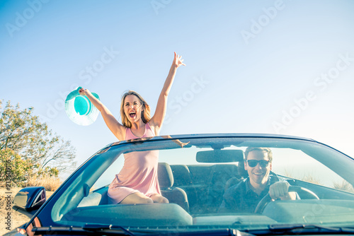 Couple on convertible car
