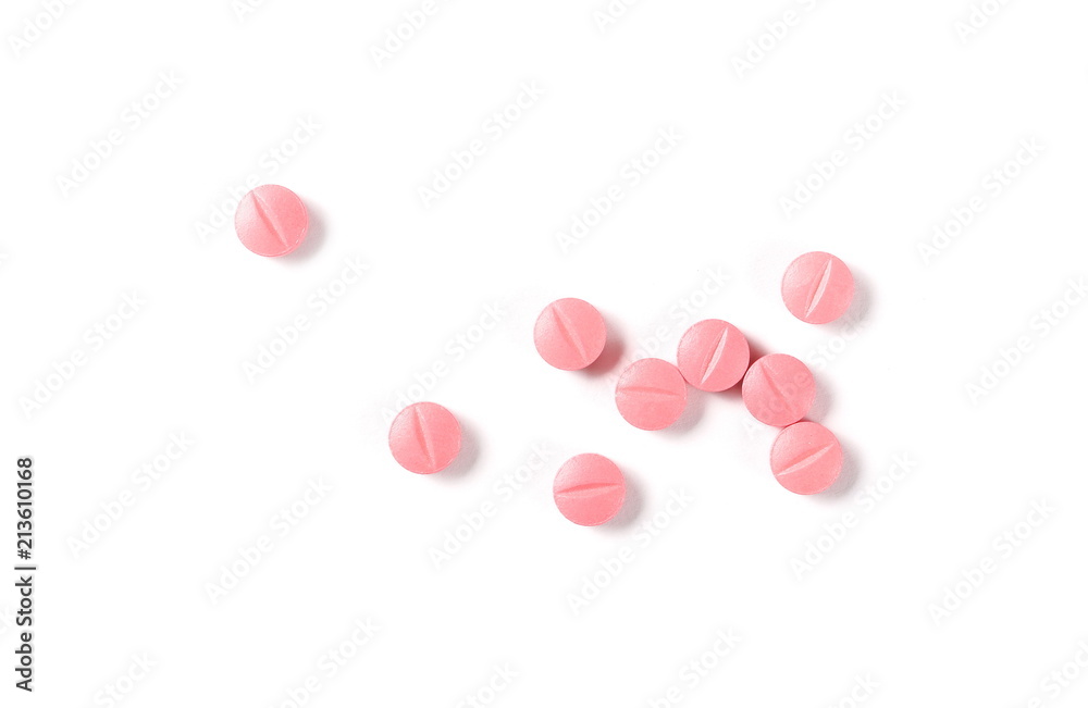 Pink pills, medicine isolated on white background, top view