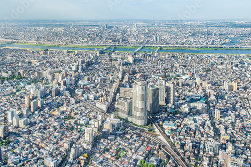 Asia Business concept for real estate and corporate construction - panoramic modern city urban skyline bird eye aerial view under sun   blue sky in Tokyo  Japan