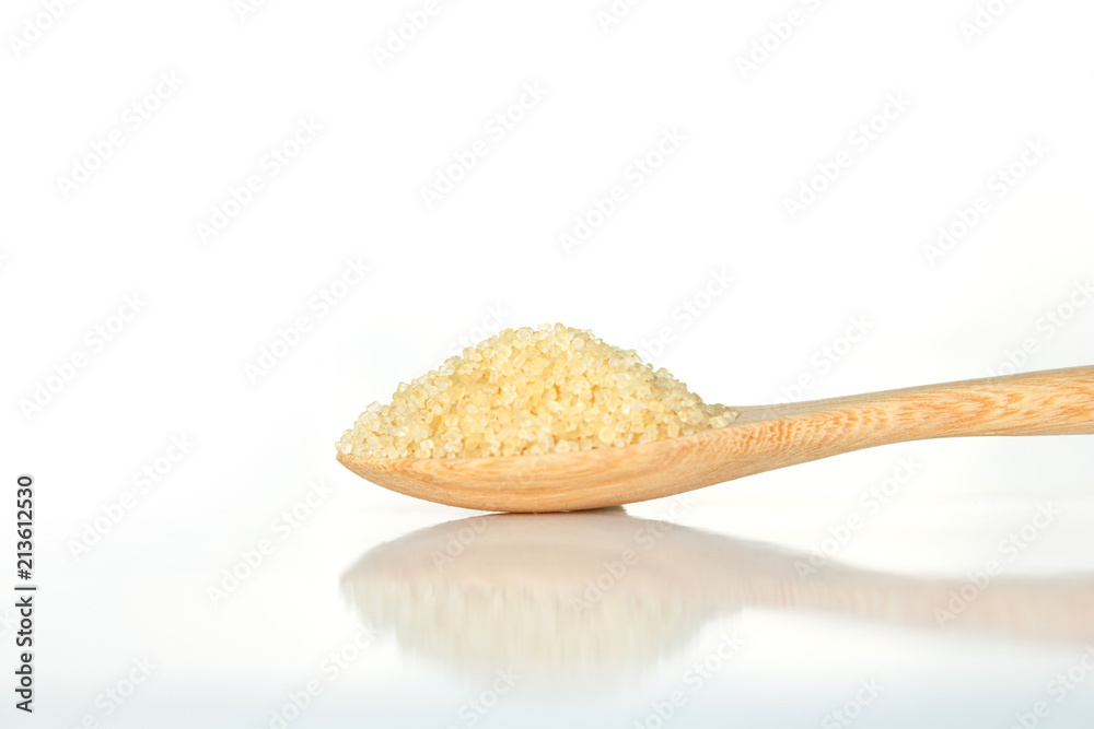 sugar cane brown on spoon and background sugar cane brown on spoon and background