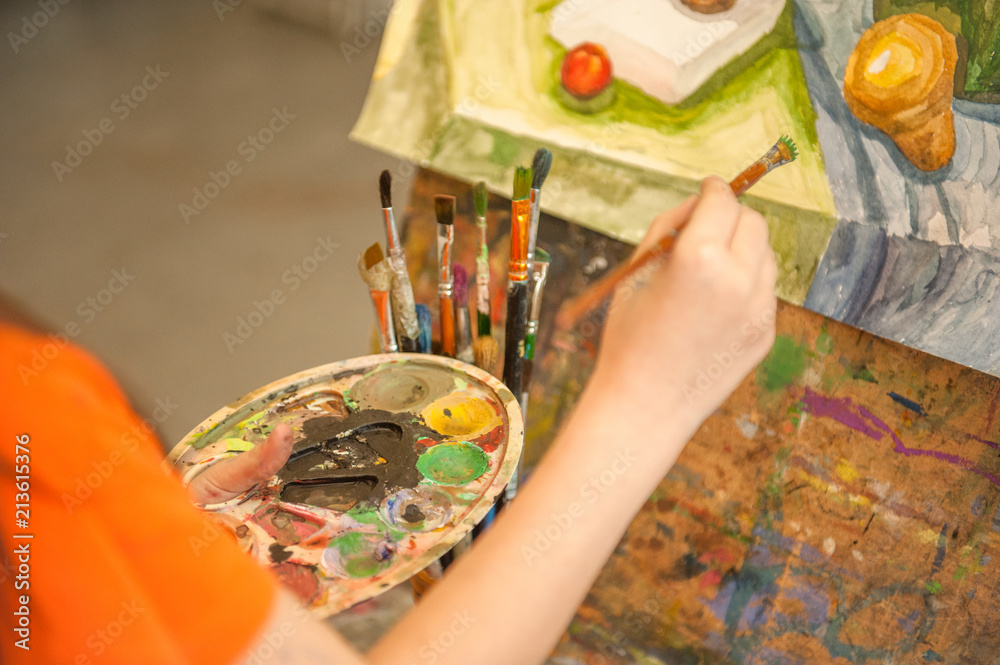 Fototapeta premium Close up children's hands draw a picture