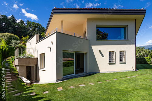 Villa with large garden during a summer day photo