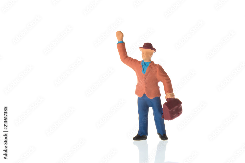 Miniature business man with suitcase isolated on white background. Miniature business man with suitcase isolated on white background.