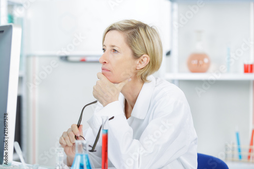 concentrated scientist doing scientific experiment in laboratory