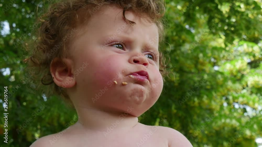 portrait of a little boy with curly hairs, outdoors portrait of a little boy with curly hairs, outdoors