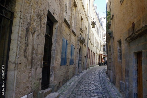 Antique narrow street with old pavement from medieval period. Strong mediterranean culture. © Christophe
