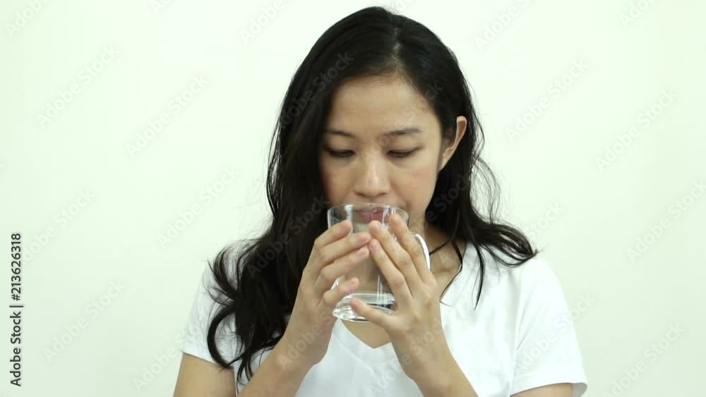 Asian woman drinking water 8 cup a day for healthy skin and body slow motion video Asian woman drinking water 8 cup a day for healthy skin and body slow motion video