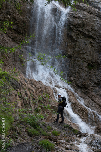 waterfall on the forest with person 