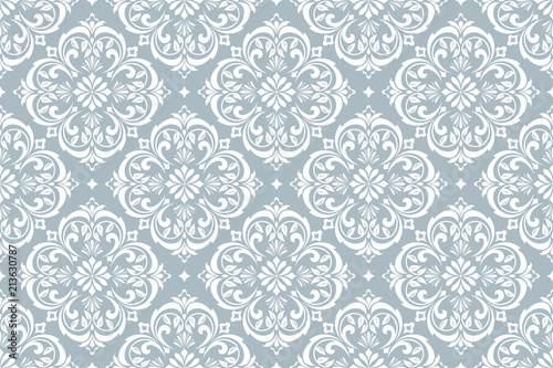 Wallpaper in the style of Baroque. Seamless vector background. White and blue floral ornament. Graphic pattern for fabric, wallpaper, packaging. Ornate Damask flower ornament