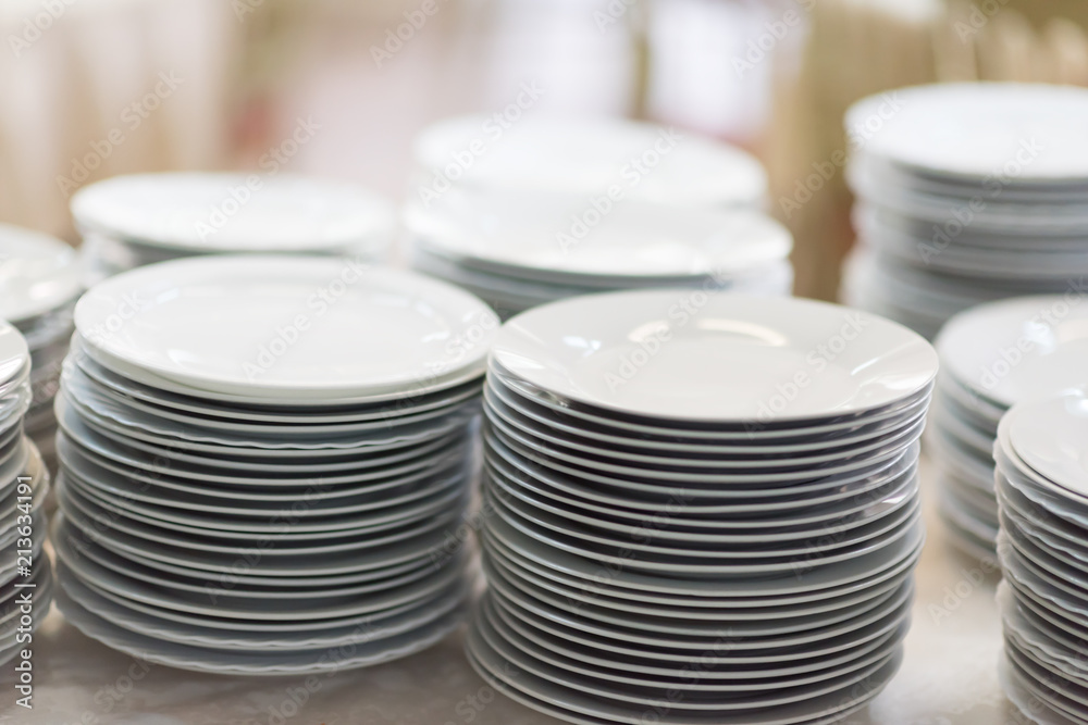 stack of white plates stack of white plates