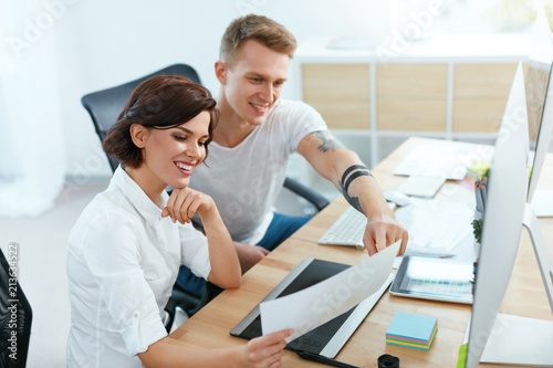 Team Of People Working On Computer In Office