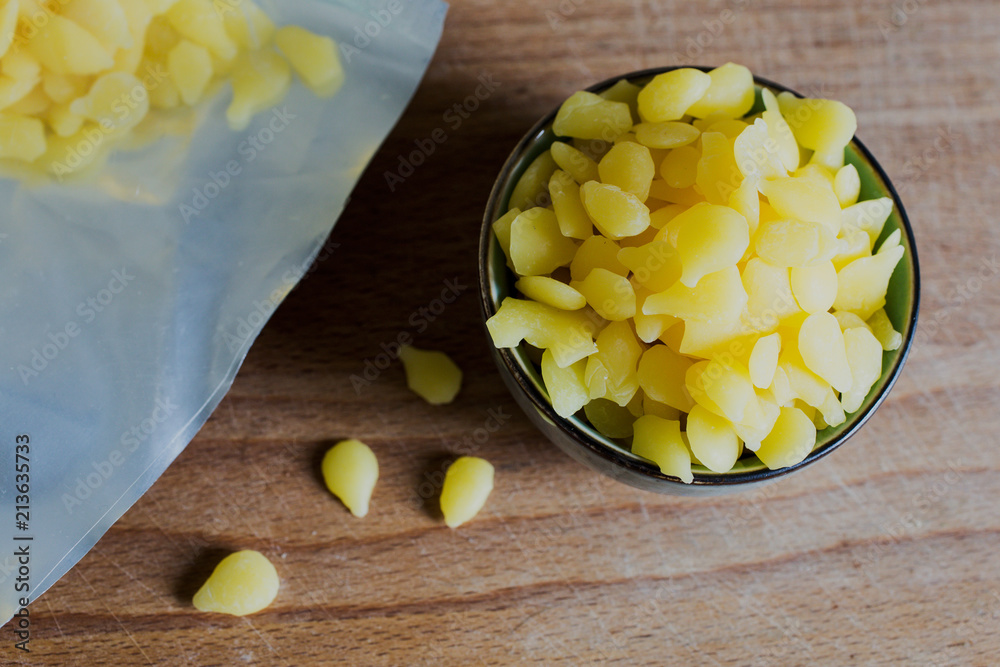 pure yellow beeswax granulate pellets for homemade cosmetic products