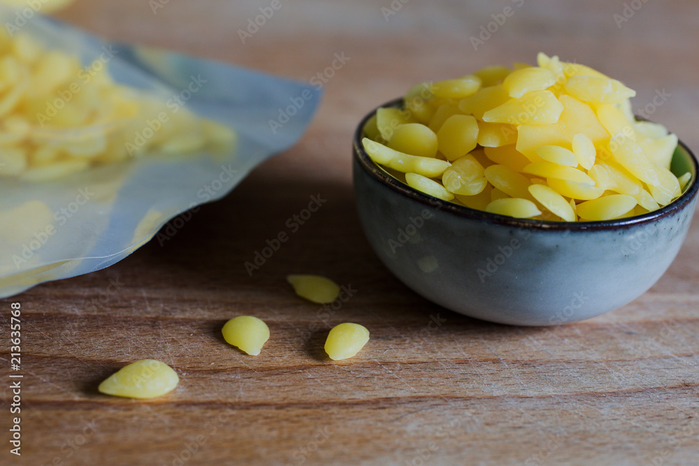 pile of pure yellow beeswax granulate pellets for diy cosmetics
