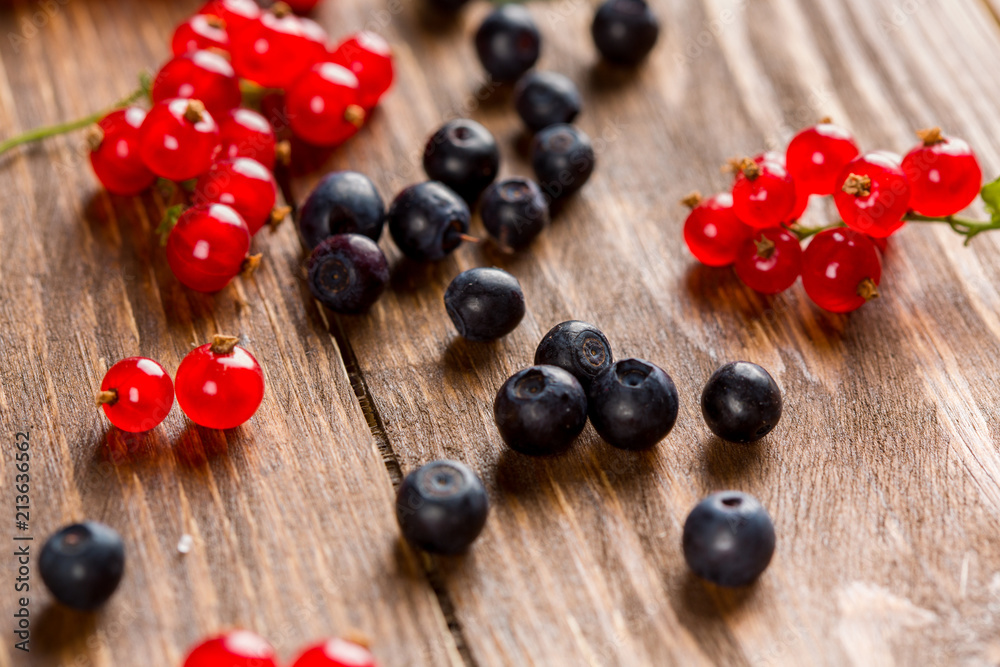 Currants and blueberries on the table. Summer berry.