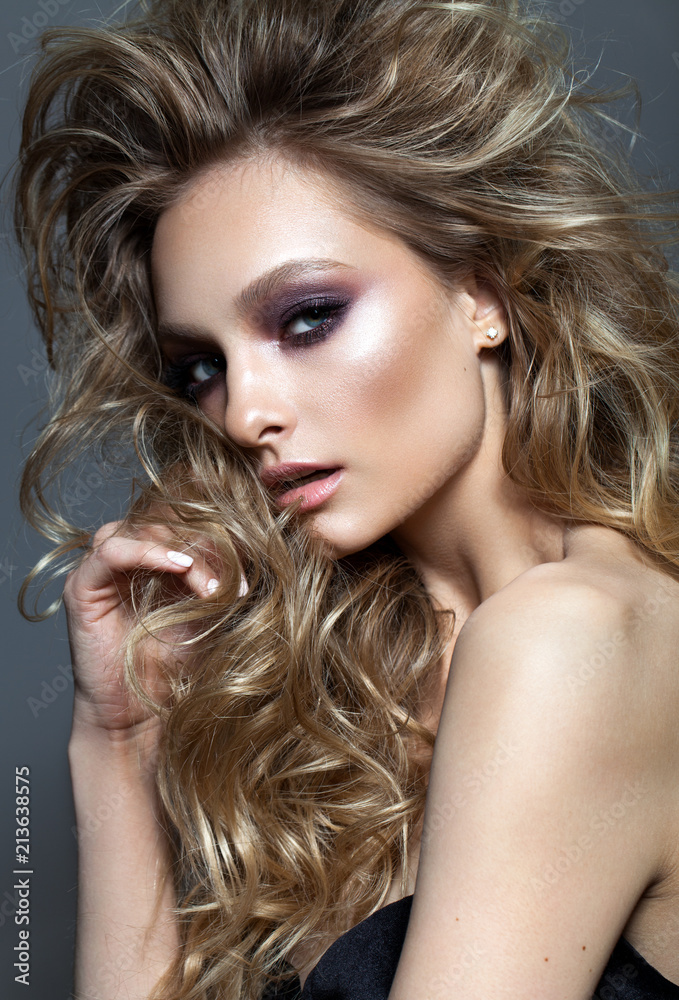 Beautiful young model with professional makeup, perfect skin, volume hairstyle Beautiful young model with professional makeup, perfect skin, volume hairstyle
