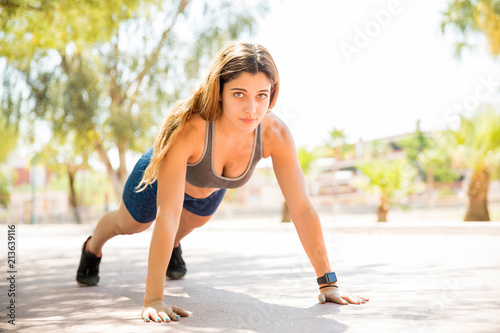 Athletic female doing push-ups