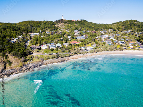 The Pass and Wategoes Beach at Byron Bay from an aerial view with blue water