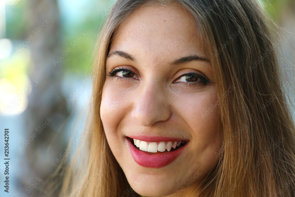 Extreme close up of young American multiracial woman smiling at the camera Extreme close up of young American multiracial woman smiling at the camera