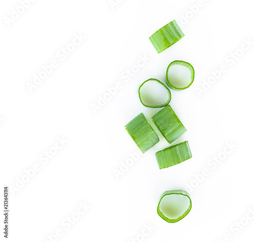 Closeup top view green onion vegetable sliced on white background