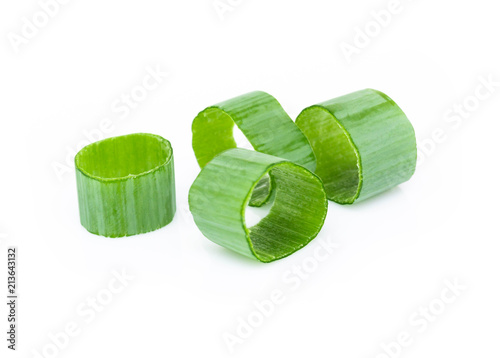 Schilderij op canvas Closeup green onion vegetable sliced on white background