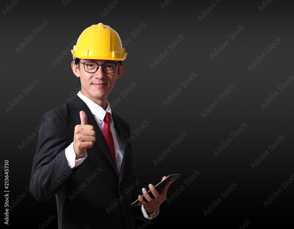 Businessman pressing modern social buttons on a black background. Businessman engineer pressing virtual button online.Engineering engineer industrial industry business. . Businessman pressing modern social buttons on a black background. Businessman engineer pressing virtual button online.Engineering engineer industrial industry business. .