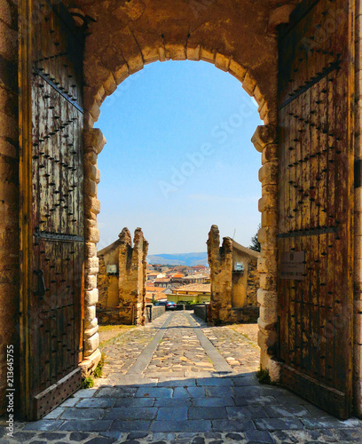 wooden open gate with view over city in medieval castle on the hill in little town Melfi, Basilicata Italy                      photo