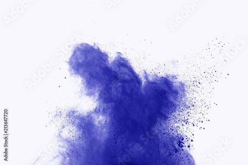 Abstract blue powder explosion on white background. abstract blue dust splatted on white background, Freeze motion of blue powder exploding.