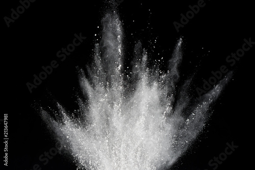 Explosion of white powder isolated on black background. Abstract of powder or clouds splatted. photo