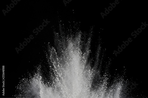 Explosion of white powder isolated on black background. Abstract of powder or clouds splatted.