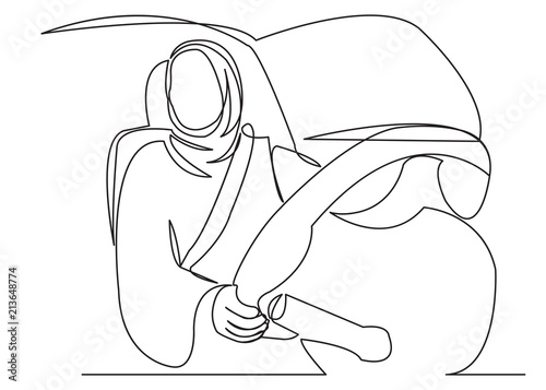muslim woman driving a car