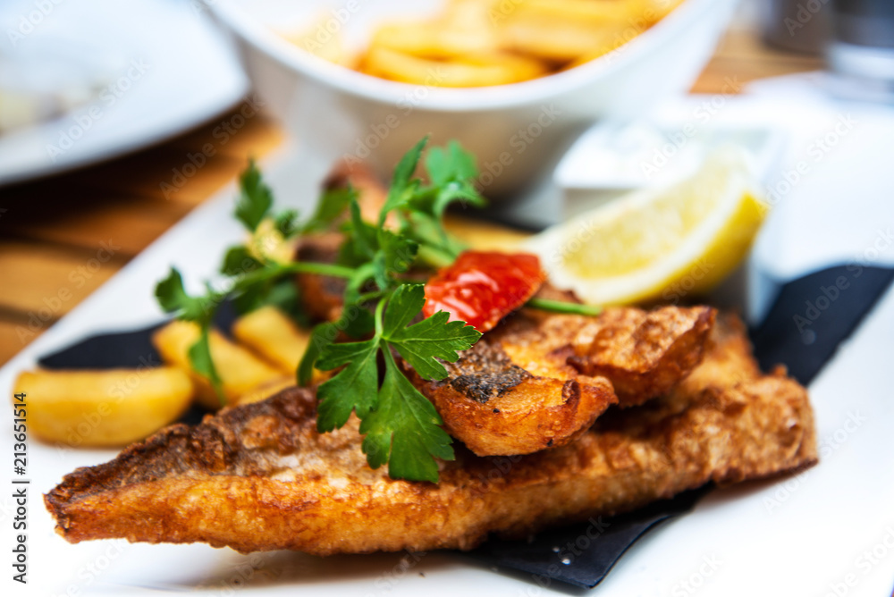 British Traditional fish and chips and tartar sauce British Traditional fish and chips and tartar sauce