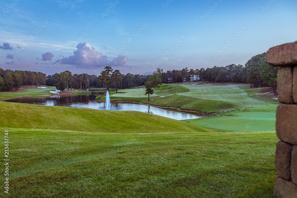 Fototapeta premium Golf Course with Pond and Water Fountain