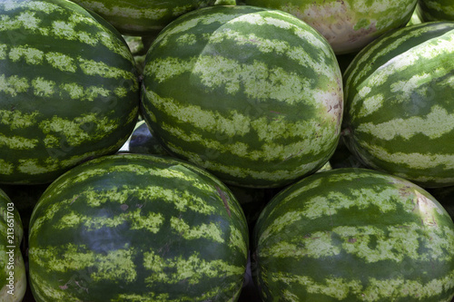 Market counter with delisios watermelons.