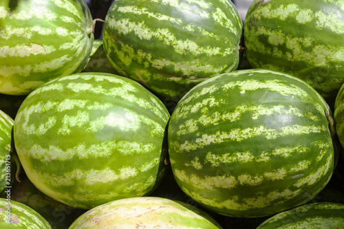 Market counter with delisios watermelons.