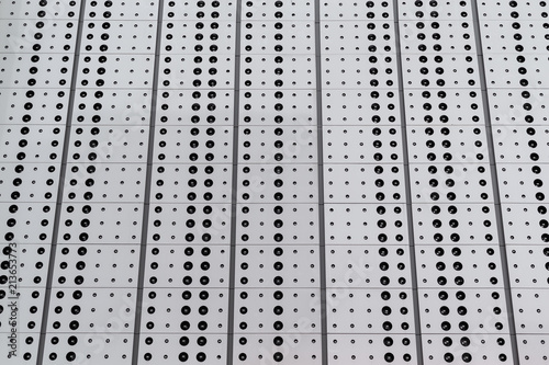 low angle view of dots on a metal surface pattern texture.