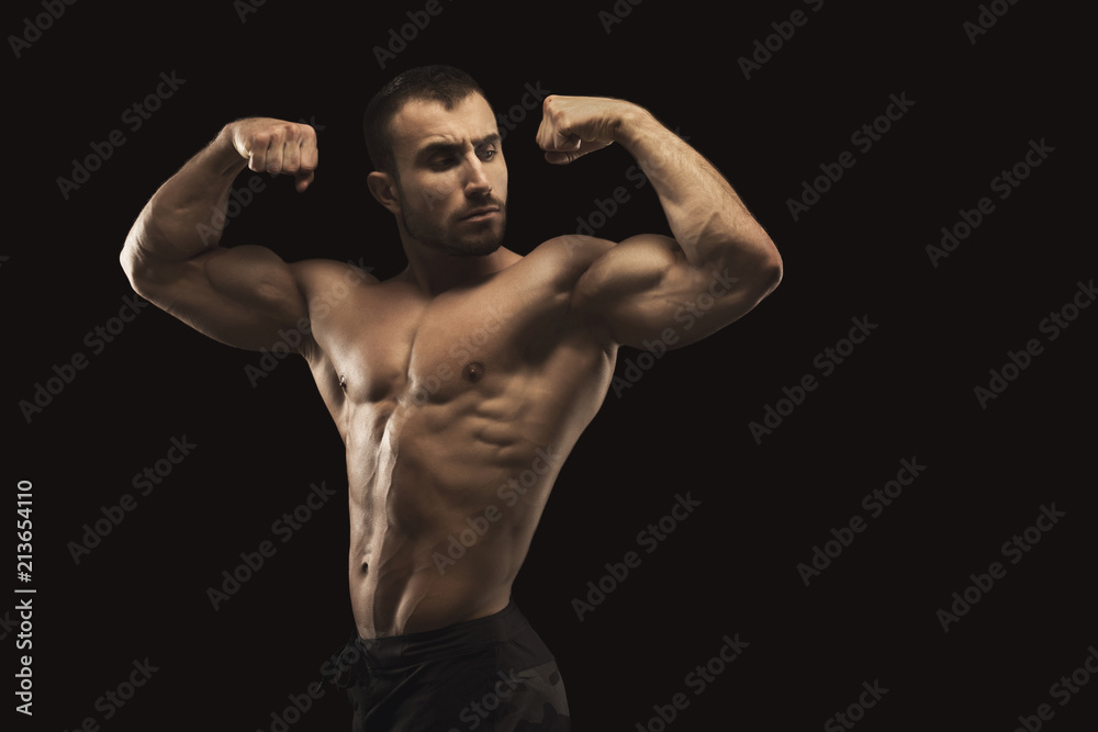 Obraz premium Strong athletic man showes naked muscular body