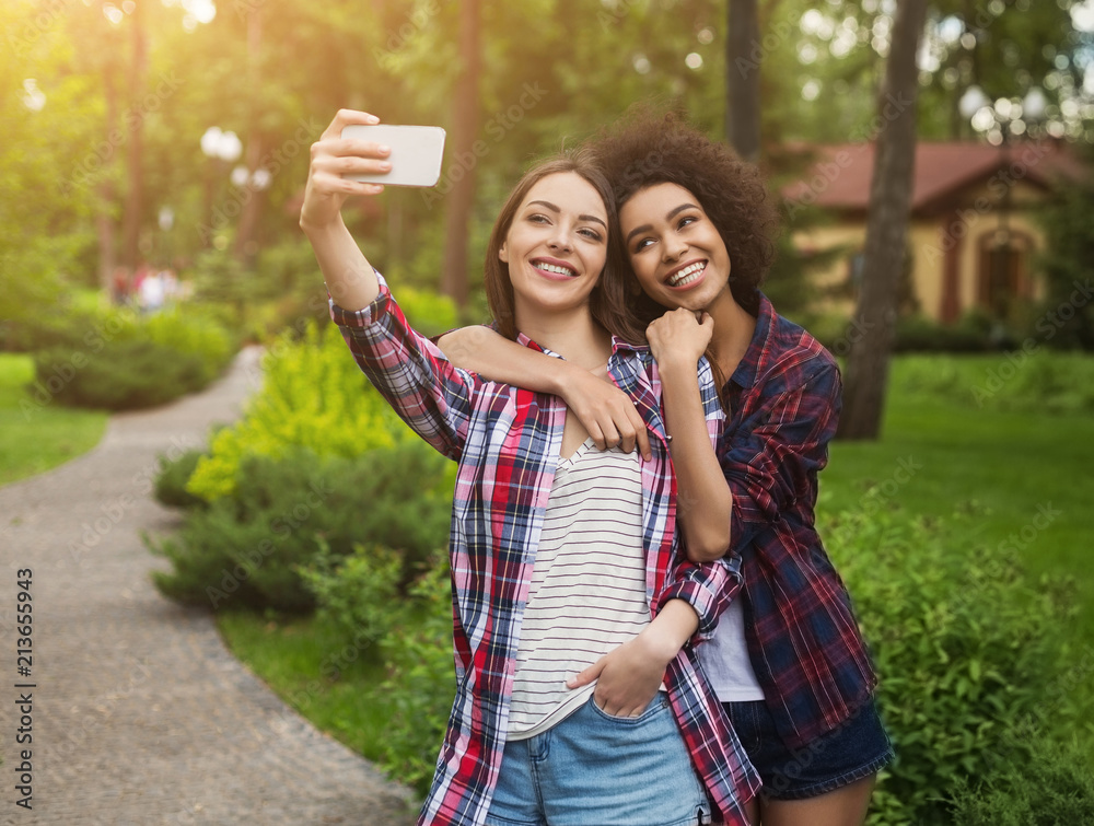 Female bloggers taking picture for publication on webpage Female bloggers taking picture for publication on webpage