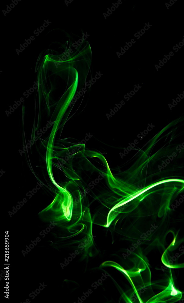 Green smoke on black background Green smoke on black background