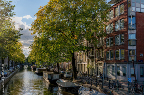 Photography Amsterdam canal view at sunset with boat houses