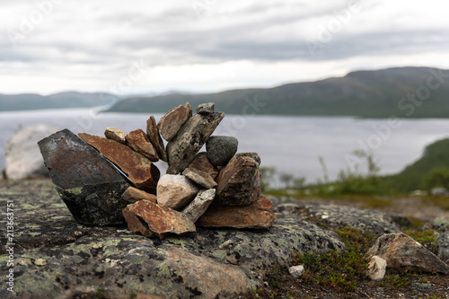 A pile of rocks on the peak of Salmivaara hill in Kilpisjarvi, Finland. photo