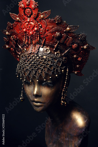 Fototapeta Naklejka Na Ścianę i Meble -  Head of mannequin in creative red kokoshnick