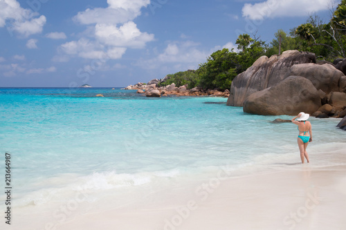 A white sand beach with turqouise water and stones © 25ehaag6