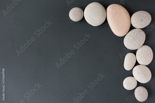 Photography gray stones with white candle and grey background