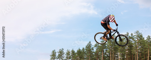 rider is jumping high on a bicycle. copy space