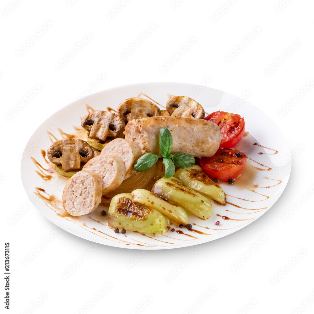 Roasted sausages with tomato sauce and vegetables on a white background Roasted sausages with tomato sauce and vegetables on a white background