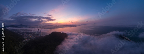 Aerial view of Camboriu Bay  Brazil  under dusk and partially under fog